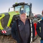 Scott Jacqui and Amery Drage standing Infront of tractor