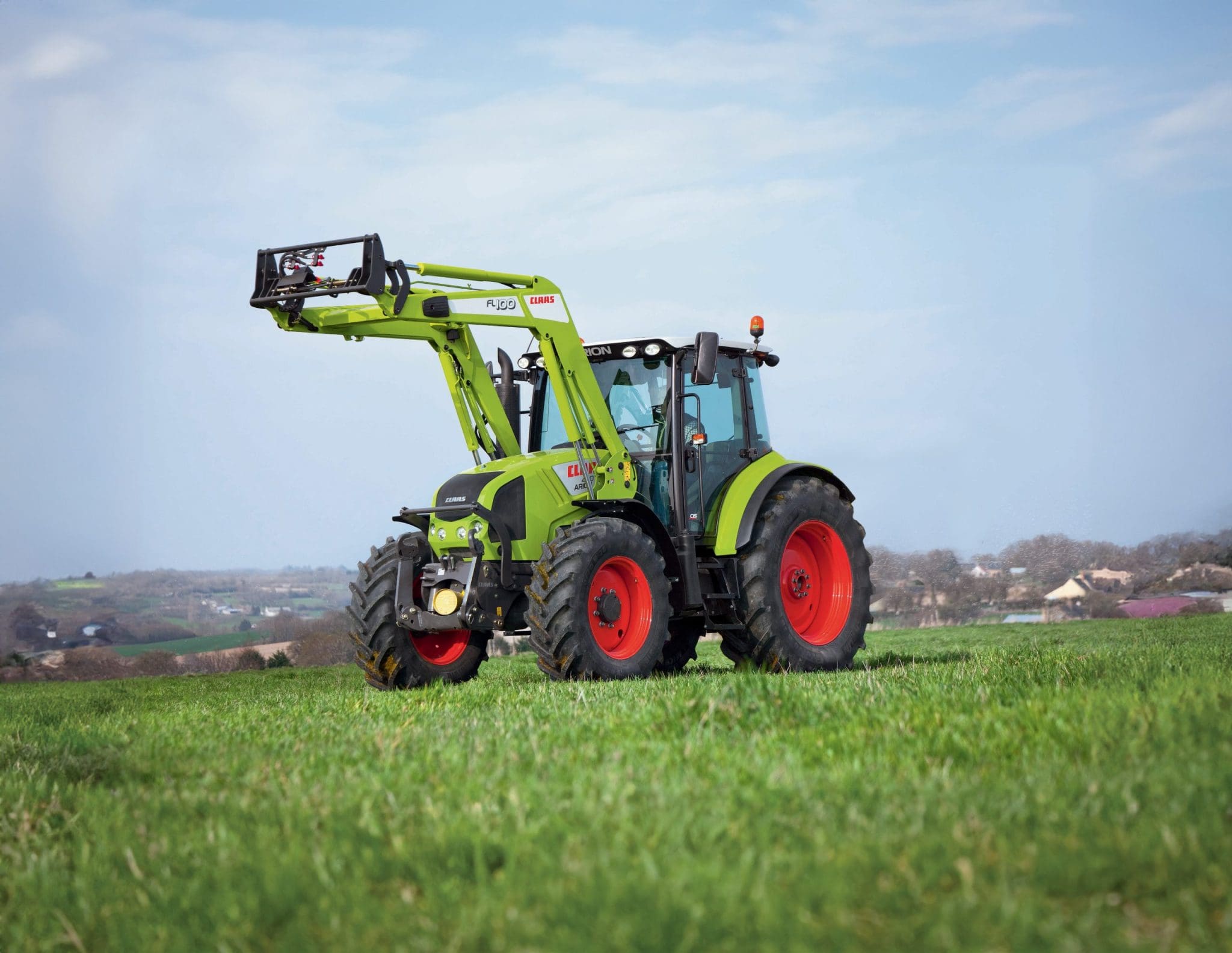 CLAAS ARION in paddock with front loader attachment