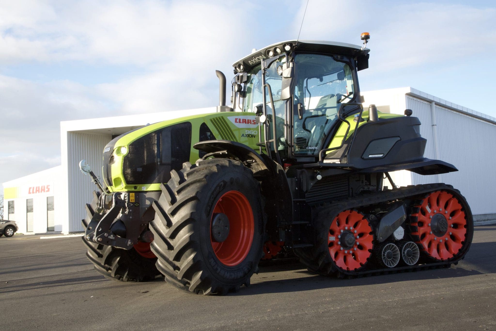 CLAAS Axion sitting outside service centre with TERRA TRAC