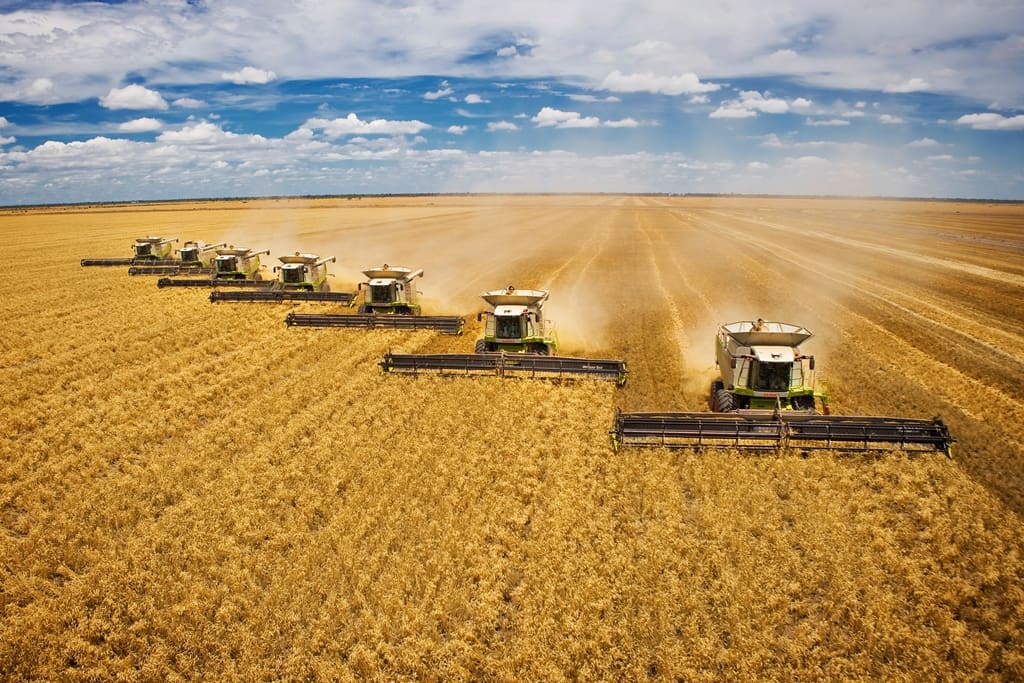 multiple combines driving