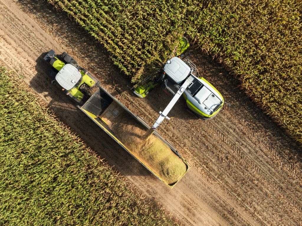 birdseye view of jaguar harvesting maize into a trailer