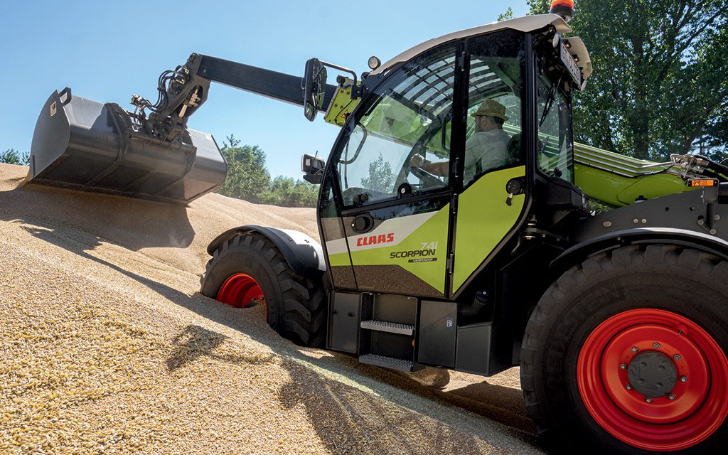 image of someone driving a claas scorpion telehandler into a stack